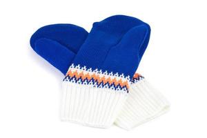 blue and white knited mittens isolated on white background photo