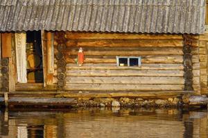 Bathhouse on lake photo