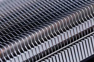 modern large heat radiator unit closeup macro background with selective focus photo