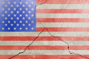 USA flag painted on cracked wall after earthquake disaster - flat texture photo