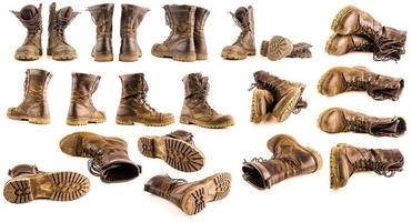 set of dirty military style light ankle boots isolated on white background photo