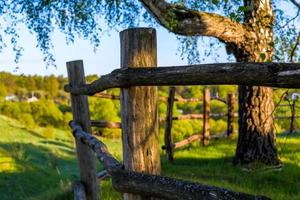 rustic view with log fence and selective focus photo