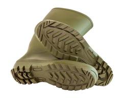 a pair of olive green clean and new rubber boots isolated on white background photo