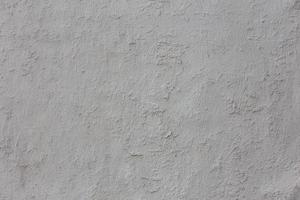 textura de yeso blanco en mal estado y fondo de fotograma completo foto