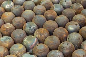 full frame industrial background of rusted steel dome workpieces after draw photo