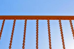 yellow railing with chains photo