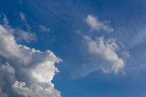 Regular spring clouds on blue sky at daylight. Close shot wit telephoto lens and polarizing filter. photo