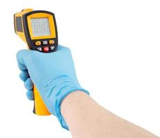 hand in blue medical latex glove aiming with infrared contactless thermometer isolated on white background, mockup display state with all on photo