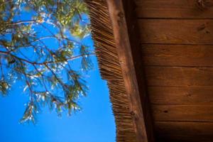 wooden straw roof with selective focus background photo