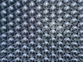 Shiny metal parts after cnc turning, on flat surface, flat lay background photo