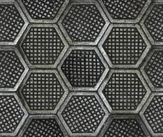 textura de suelo de fábrica hexagonal de hierro fundido. foto