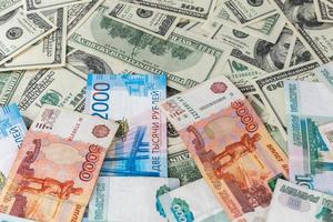 russian rubl and us dollar banknotes close-up with selective focus photo