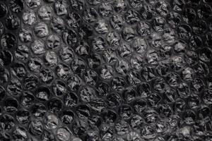 dark air bubble wrap - real life close-up texture and background photo