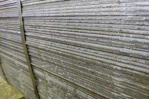 stack of mild steel sheets, full-frame close-up view with selective focus photo