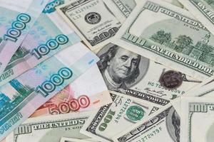 us dollars and russian rubles close-up background with selective focus photo