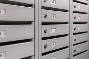 mailboxes on the landing of russian condominium - close-up view with selective focus and linear perspective photo