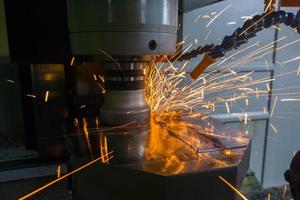 Heavy milling of thick hardened plate with sparks under air blow photo