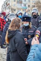 TULA, RUSSIA  JANUARY 23, 2021 Public mass meeting in support of Alexei Navalny, pretty underage girl argues with the police. photo