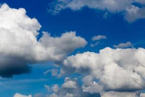 Regular spring clouds on blue sky at daylight in continental europe. Close shot wit telephoto lens and polarizing filter. photo