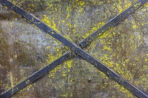 obsolete painted industrial flat iron panel texture with welded steel diagonal cross stripes for rigidity photo