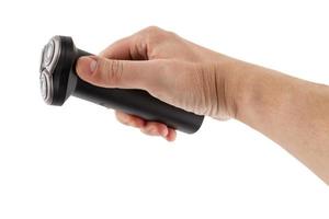 bare caucasican hand holding three razor black electric shaver - isolated photo