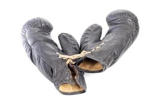 old black leather boxing gloves isolated on white background photo