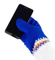 cellphone with white-blue mittens isolated on white background photo