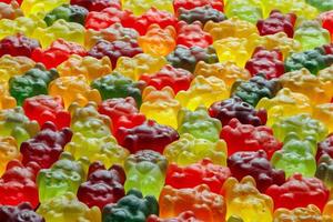 full-frame background of colorful jelly bears laid closely on flat surface photo