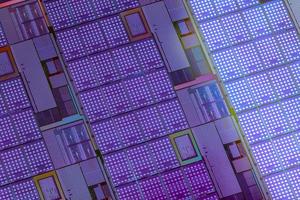 Silicon wafer with microchips used in electronics for the fabrication of integrated circuits. Full-frame high-tech macro background. photo