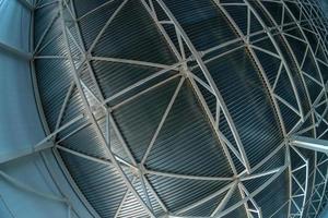 fish-eye lens picture of industrial ceiling with supporting beam construction frame and profiled sheets photo