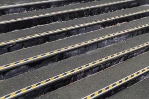 full frame background of roofing felt stairs with striped aluminium corners in diagonal perspective composition photo