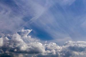 mixed cumulus and feather clouds closeup telephoto shot with polarizing effect. photo