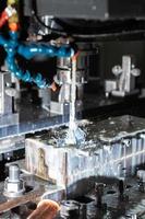 a process of cnc vertical reaming with liquid coolant flow photo