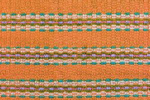 old turquoise towel with horizontal stripes ornament - flat background and texture photo