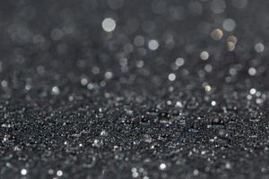 dark grey water resistant hydrophobic flat cloth with rain drops, close-up background with selective focus photo