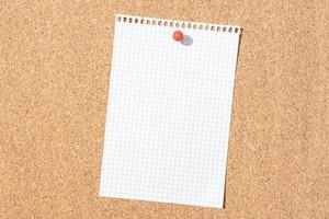 Blank grid paper sheet pinned on cork board. Template Mock up photo