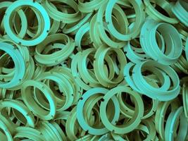 un fondo abstracto de piezas de anillo de metal recubiertas de color aqua menthe foto