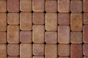 flat texture and full-frame background of brown cuboid concrete brick pavement with rounded corners photo