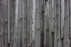 old dry weathered gray wooden board surface - full frame background and texture photo
