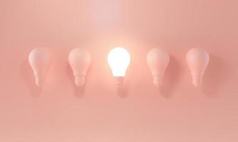 Glowing Light Bulb between the others on pastel orange background. Leadership, innovation, idea and individuality concepts. 3d rendering. photo