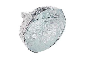 Aluminium foil hat isolated on white background, symbol for conspiracy theory and mind control protection. photo