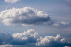 Regular spring clouds on blue sky at daylight in continental europe. Shot wit telephoto lens and polarizing filter. photo