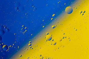 Oil on water flat colorful duotone macro abstract background photographic image. photo