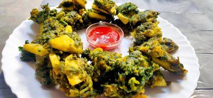 Spinach and potato Pakoras, An extremely delicious and mouth watering snack of Pakistani and Indian Peoples photo