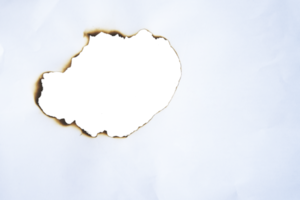 burnt paper frame for texture overlay. damaged white paper with burnt stain in transparent background. blank ripped paper edge for a design element. png