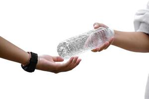 Giving plastic bottle to make recyclying, reusing and reducing objects to lower garbage and to keep our environment clean and clear to everyone concept, soft and selective focus. photo