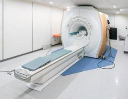 MRI - magnetic resonance imaging - scanner machine in hospital room, nobody inside photo