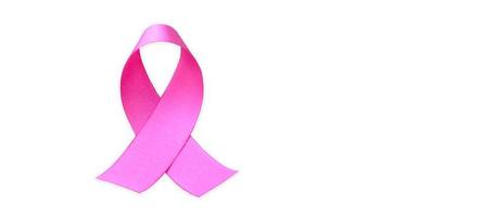 Isolated pink ribbon, symbol of female breast cancer awareness campaign in Ocotober, with clipping paths. photo