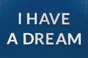 a famous phrase i have a dream laid with silver metal characters on classic blue board in flat lay centered photo