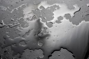 abstract background of wet black hydrophobic surface - close-up with selective focus photo